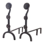A pair of wrought iron fire dogs, in Arts & Crafts taste,