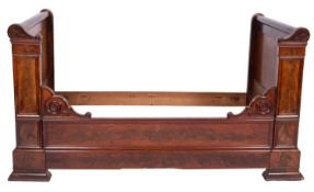 A Louis Philippe mahogany bed, circa 1840; with outscrolled ends,