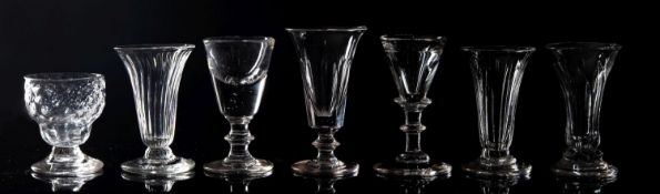 A mixed group of glass jellies, custard cups, a pair of punch cups, a medicine measure,