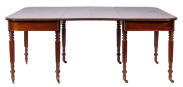 A Regency mahogany extending dining table,