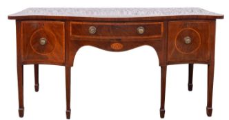 A George III mahogany and crossbanded serpentine front sideboard,