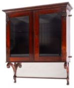 A George IV rosewood and glazed wall hanging cabinet,