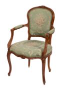 A carved and stained wood and green upholstered canapé elbow chair in Louis XV style,
