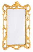 A carved and giltwood framed rectangular wall mirror, in George III style,