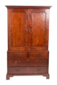A George III mahogany linen press, in the manner of Giles Grendy,