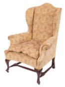 A Victorian upholstered wing armchair,