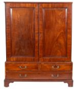 A George II mahogany dwarf linen press, mid 18th century; the top with moulded edges,