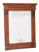 A stained walnut framed wall mirror, in Neoclassical style,