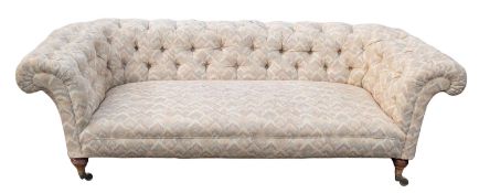 A Victorian and later upholstered Chesterfield sofa, by Howard & Sons, London,