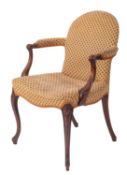 A mahogany and upholstered library elbow chair in George III style,