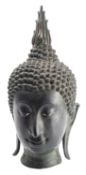 A large Thai bronze Buddha head, 20th century with ushnisha, curled hair and flame finial,