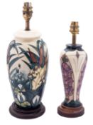 Two Moorcroft pottery lamps tube lined in the Lamia and Foxglove patterns after designs by Rachel