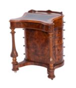 A Victorian burr walnut veneered Davenport, circa 1870; bow backed,