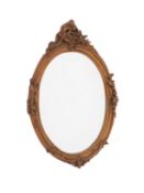 A gilt composition framed oval wall mirror, in 18th century taste,