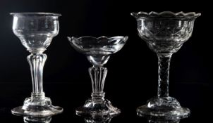 An English sweetmeat glass and two others the former with panel moulded ogee bowl with everted rim