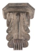 A carved and stained oak wall bracket,