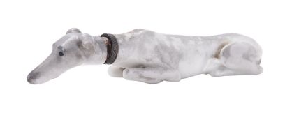 A porcelain scent or snuff bottle modelled as a recumbent hound,