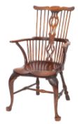 A George III elm and probably fruitwood Windsor elbow chair,