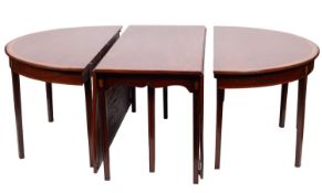 A mahogany, crossbanded and marquetry extending dining table in George III style,