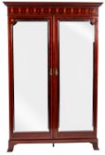An Edwardian mahogany and marquetry wardrobe, in Sheraton taste,
