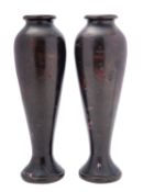 A pair of Japanese inlaid bronze vases, Meiji period of slender baluster form,