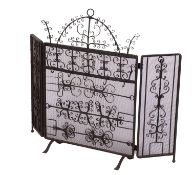 A wrought iron and mesh spark guard,