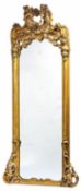 A substantial giltwood and composition framed pier mirror in Rococo Revival style,