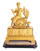 A French Empire ormolu mantel clock having an eight-day duration movement with silk-suspension