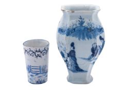 A Dutch delft vase of shouldered octagonal form and with embossed panels painted in blue with