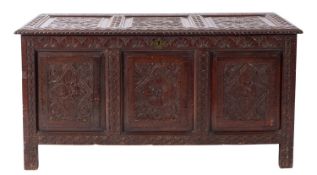 A carved and stained oak coffer in Jacobean style,