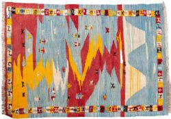 A Qashgai Kelim, the powder blue landscaped field with figures,