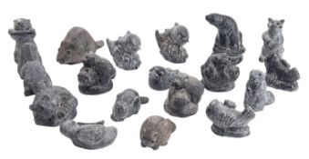 A collection of twenty Inuit simulated argillite composition models,