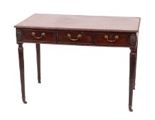 A mahogany side table in Regency style, circa 1900; the top with relief carved foliate edges,