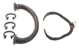 Three copper alloy manilla currency 'bangles', West Africa, 19th century,