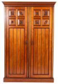 A Victorian walnut and partially ebonised wardrobe in Aesthetic Movement style, possibly by Gillow,