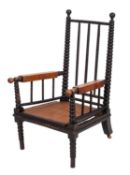 A Victorian bobbin-turned and ebonised ash elbow chair,