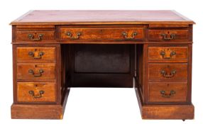A walnut pedestal desk in George III style,