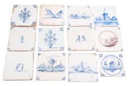 A group of eighteen Dutch Delft tiles, all but one painted in blue with animal,