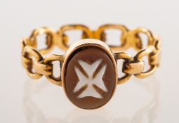 A Maltese cross cameo ring, collet set with a carved Maltese cross cameo,