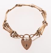 A gate bracelet, with heart padlock and safety chain, heart padlock marked 9c, length approx. 19.