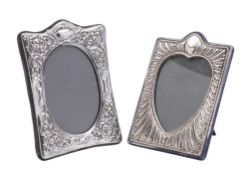 A modern silver mounted photograph frame, of shaped rectangular outline,