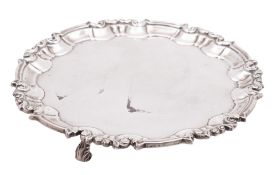 A late Victorian small silver salver, of shaped circular outline, with a moulded,