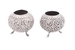 A pair of late 19th/ early 20th century Far-Eastern silver pots/ vases, ellipsoid form,