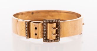 An antique seed pearl buckle bangle, (possibly late Victorian/early 20th century),