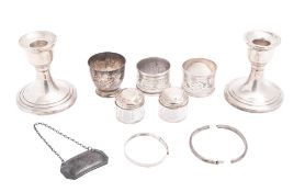 A mixed lot of silver, to include a pair of dwarf candlesticks (loaded) 2 napkin rings (initialled),