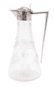 An Art-Nouveau German silver mounted clear glass jug, tapering circular form,