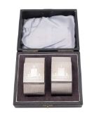 A George VI cased pair of silver napkin rings, with engine-turned and Art-Deco style decoration,