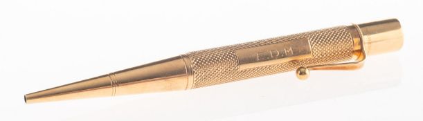 A late 1940's 9ct gold pencil, with twist top, engine turned engraving,