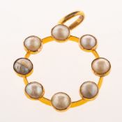 A pearl pendant, a circular frame collet and spaced set around with eight split pearls,