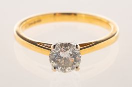 An 18ct gold 0.75 carat diamond solitaire ring, early 2000's, four claw set in white gold with a 0.